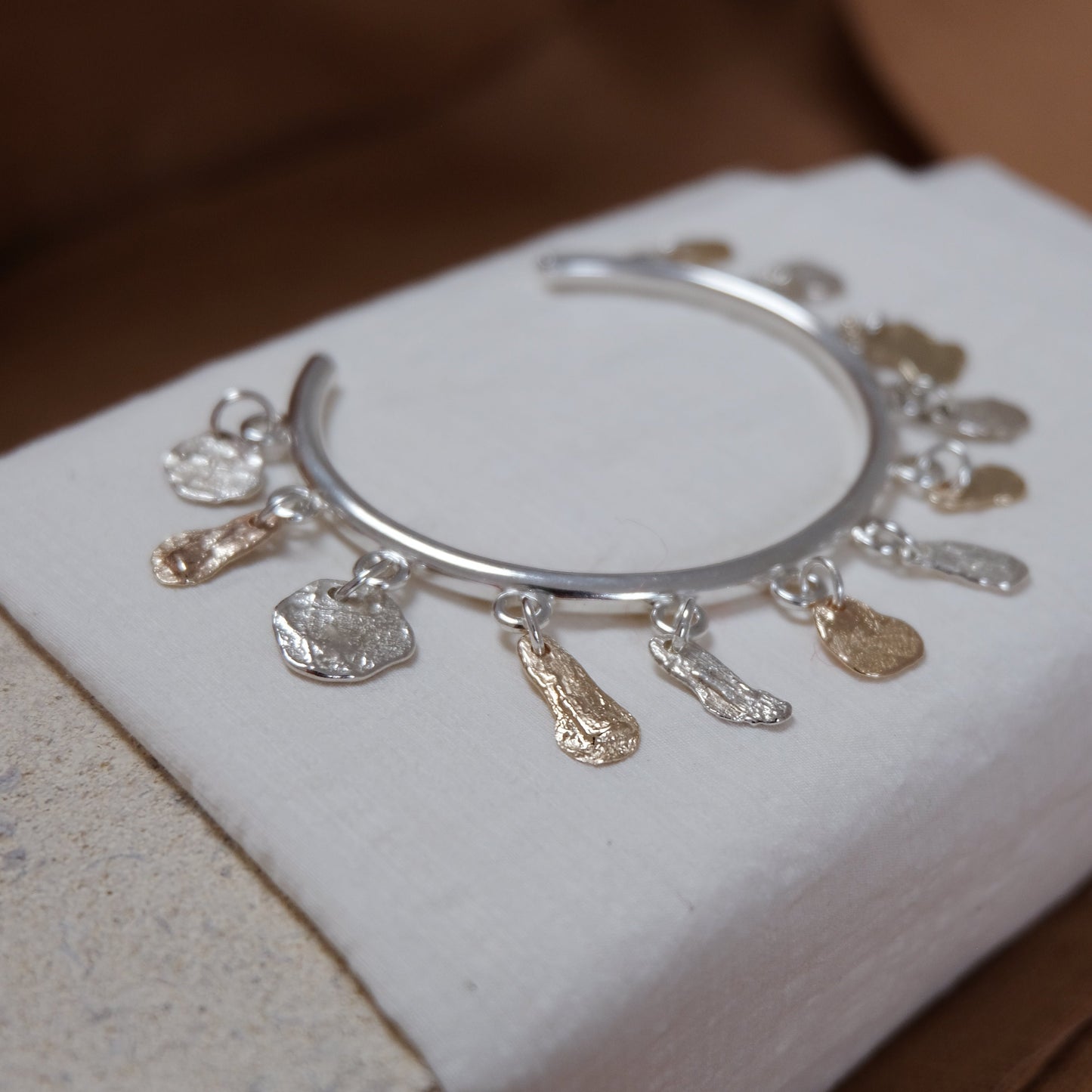 Charm rock bangle, Silver & Gold