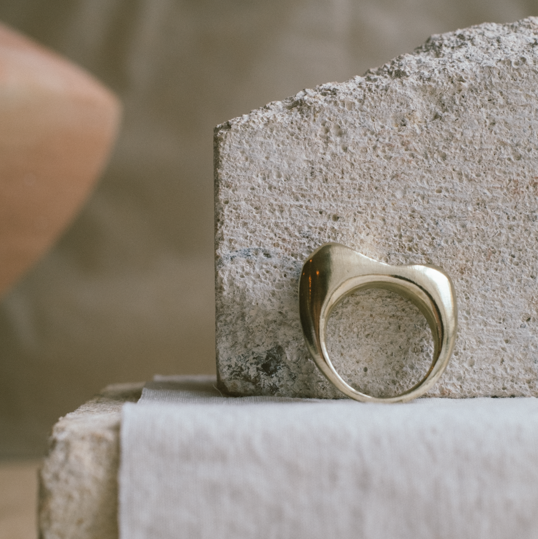 Curved brass sustainable ring