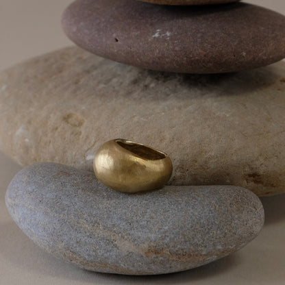 A gold bold dome ring , hand carved, hand made ring