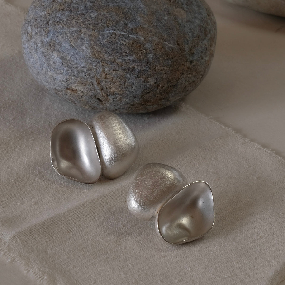 Silver hand formed statement lightweight earrings. Contemporary and ethical earrings 