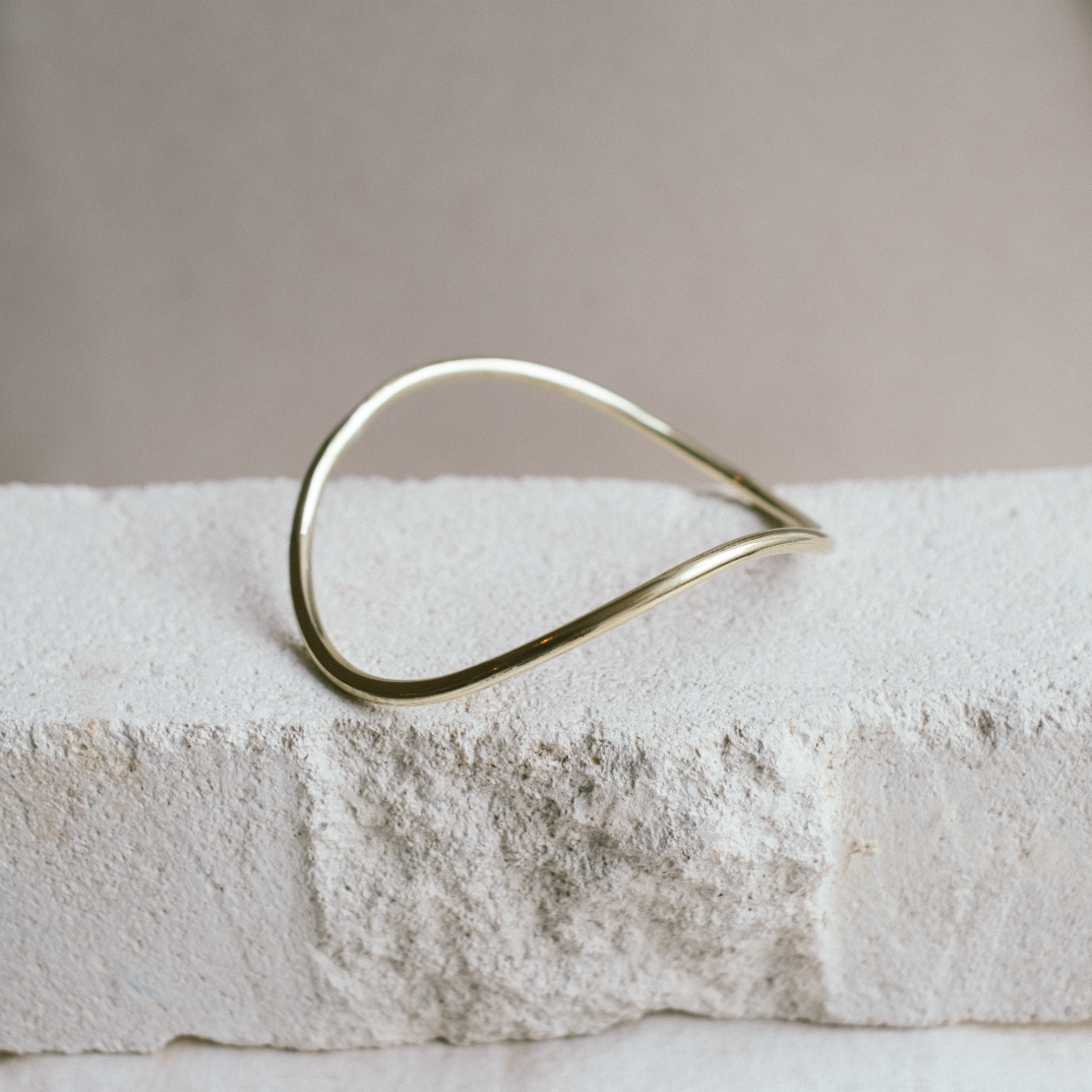 curved gold bangle