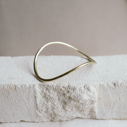 curved gold bangle